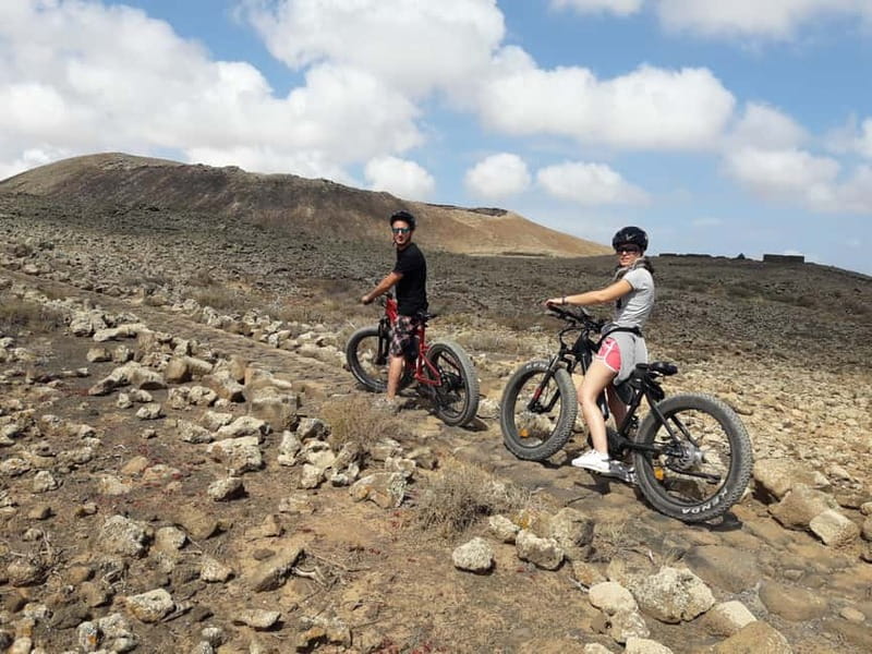 From Corralejo: Fuerteventura Guided E-Bike/E-scooter Tour - Majanicho: quiet fishing village energy and white-sand feel