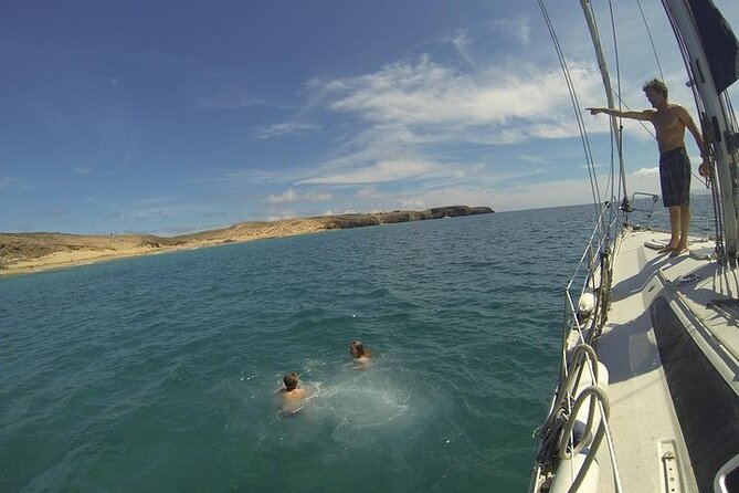 Private Sunset Sailing Charter for Couples from Corralejo - The Lobos Island stop: snorkel, paddle surf, swim, or just relax