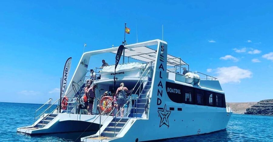 Southeast Fuerteventura: Boat Cruise with Lunch and Drinks - Cala del Caracol swim stop: snorkeling and paddleboarding in a no-road cove
