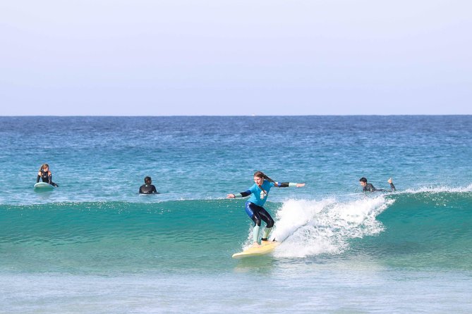 Surf Class at Corralejo - Gear That Keeps You Comfortable: board, wetsuit, leash, and wax